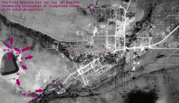 Aerial view of mining cyanide pond and Pony, Montana.